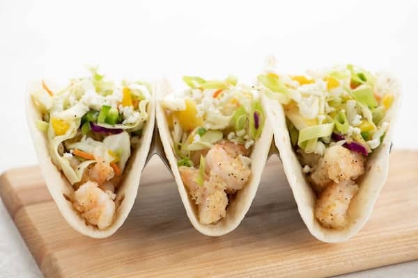 Baja Mango Shrimp Tacos with guacamole and queso fresco