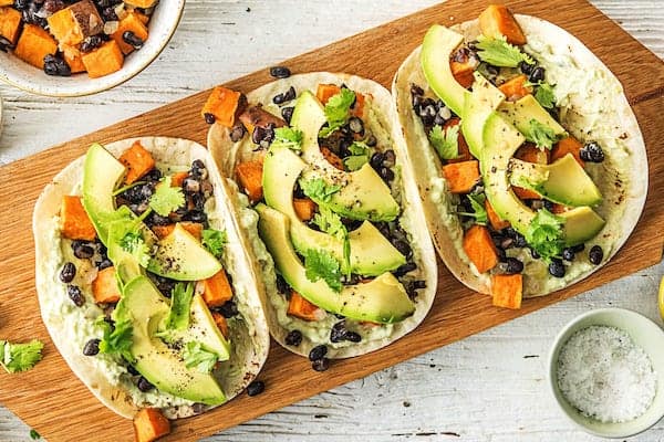 Sweet Potatoes and Black Bean Tacos with Avocado-Lime Crema